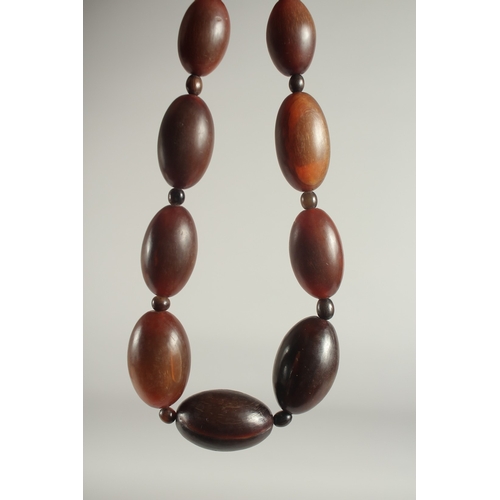 50 - A GRADUATED RHINO HORN BEAD NECKLACE.