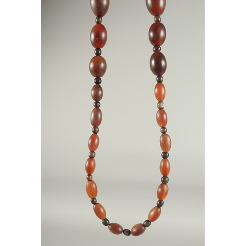 50 - A GRADUATED RHINO HORN BEAD NECKLACE.