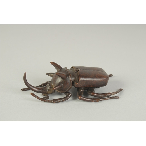 74 - A JAPANESE BRONZE OKIMONO OF A RHINOCEROS BEETLE, with hinged back opening to reveal inner container... 
