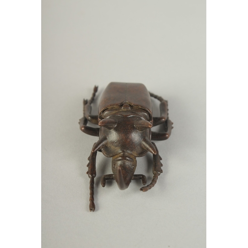 74 - A JAPANESE BRONZE OKIMONO OF A RHINOCEROS BEETLE, with hinged back opening to reveal inner container... 