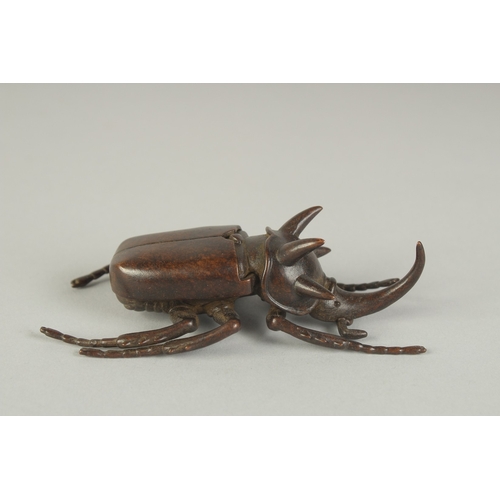 74 - A JAPANESE BRONZE OKIMONO OF A RHINOCEROS BEETLE, with hinged back opening to reveal inner container... 