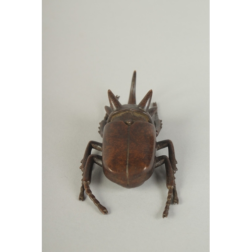 74 - A JAPANESE BRONZE OKIMONO OF A RHINOCEROS BEETLE, with hinged back opening to reveal inner container... 