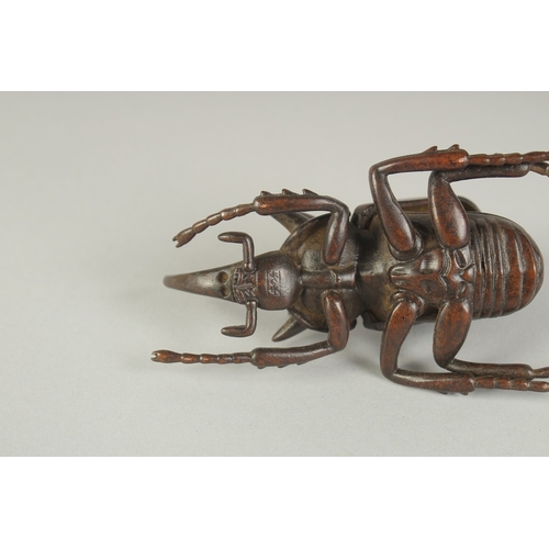 74 - A JAPANESE BRONZE OKIMONO OF A RHINOCEROS BEETLE, with hinged back opening to reveal inner container... 