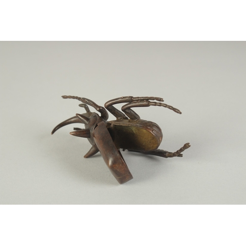 74 - A JAPANESE BRONZE OKIMONO OF A RHINOCEROS BEETLE, with hinged back opening to reveal inner container... 