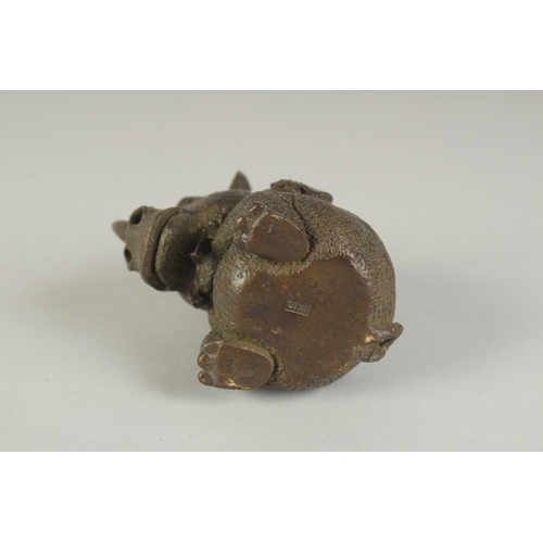 78 - A JAPANESE BRONZE OKIMONO OF A RHINOCEROS, 6.5cm high.