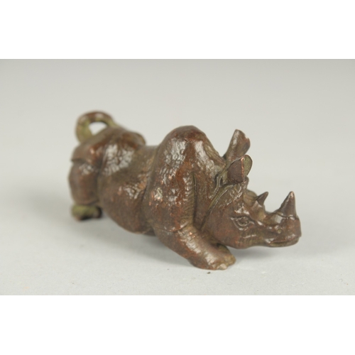 82 - A JAPANESE BRONZE OKIMONO OF A RHINO, 7.5cm long.