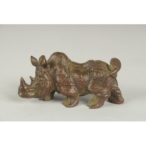 82 - A JAPANESE BRONZE OKIMONO OF A RHINO, 7.5cm long.