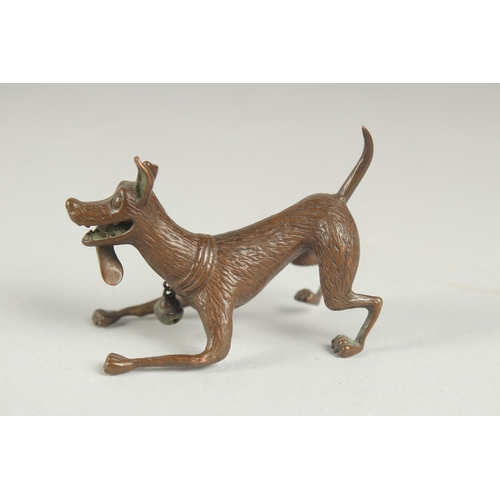 83 - A JAPANESE BRONZE OKIMONO OF A DOG, with hanging bell on the collar, mark to underside, 6.5cm long.