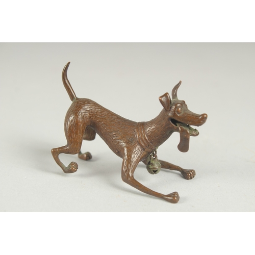 83 - A JAPANESE BRONZE OKIMONO OF A DOG, with hanging bell on the collar, mark to underside, 6.5cm long.