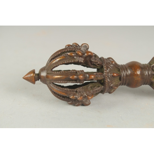 85 - A TIBETAN BRONZE VAJRA, 14.5cm long.