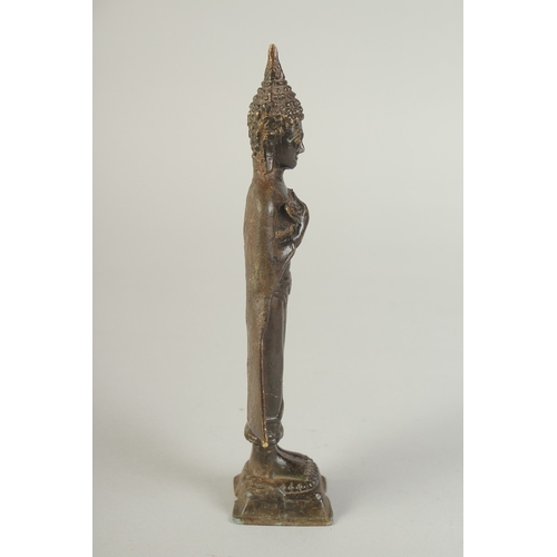 91 - A BRONZE STANDING BUDDHA, 22cm high.