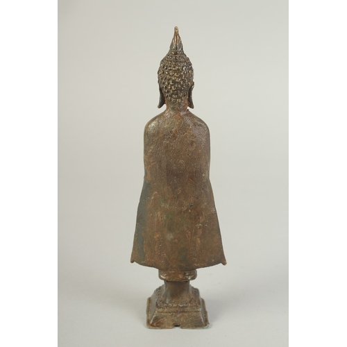 91 - A BRONZE STANDING BUDDHA, 22cm high.