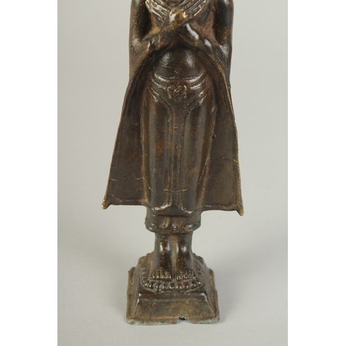 91 - A BRONZE STANDING BUDDHA, 22cm high.