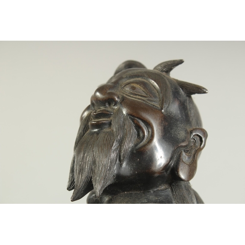 92 - A LARGE 19TH CENTURY CHINESE BRONZE FIGURE OF LI TIEGUAI, elevated upon a large rock-formed bronze b... 