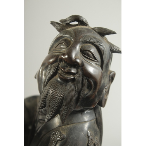 92 - A LARGE 19TH CENTURY CHINESE BRONZE FIGURE OF LI TIEGUAI, elevated upon a large rock-formed bronze b... 