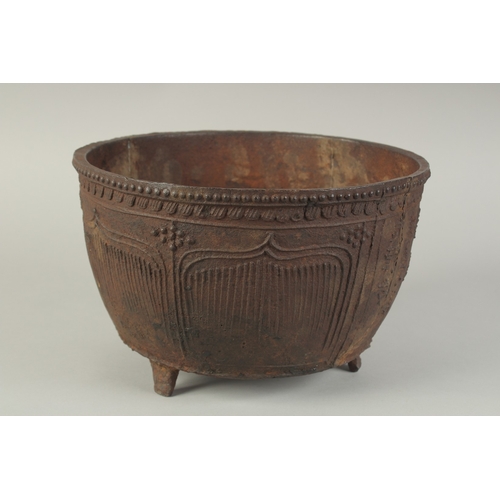 94 - AN EARLY MING CAST IRON CENSER, with script and lotus decoration, raised on three feet, 29cm diamete... 