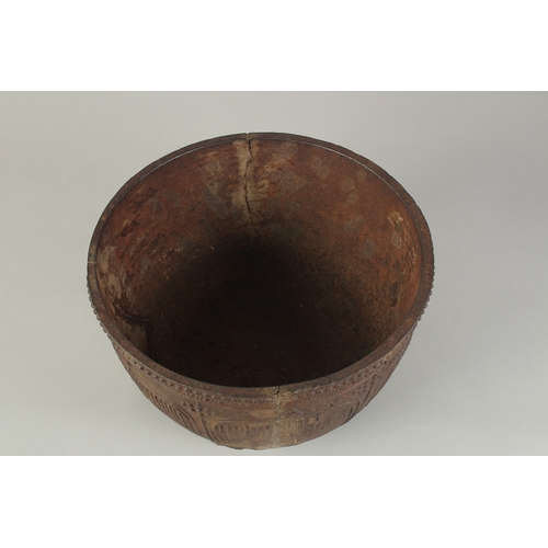 94 - AN EARLY MING CAST IRON CENSER, with script and lotus decoration, raised on three feet, 29cm diamete... 