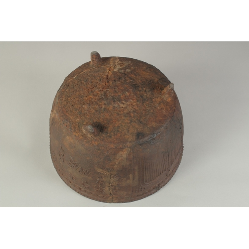 94 - AN EARLY MING CAST IRON CENSER, with script and lotus decoration, raised on three feet, 29cm diamete... 