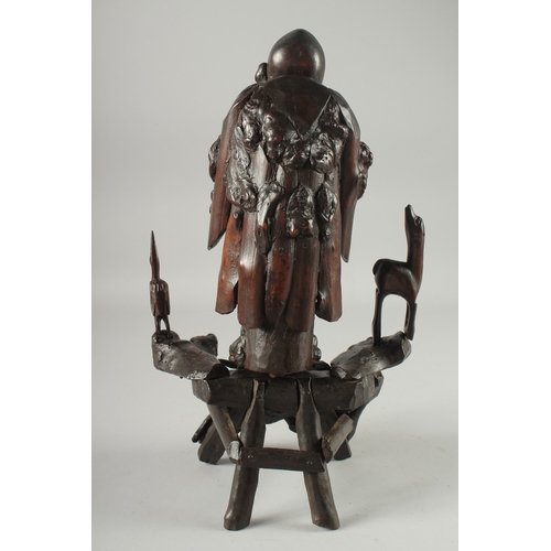 95 - A CHINESE SECTIONAL ROOT WOOD CARVING OF SHOU LAO, 41cm high overall.