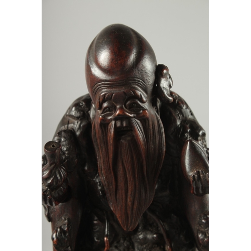 95 - A CHINESE SECTIONAL ROOT WOOD CARVING OF SHOU LAO, 41cm high overall.