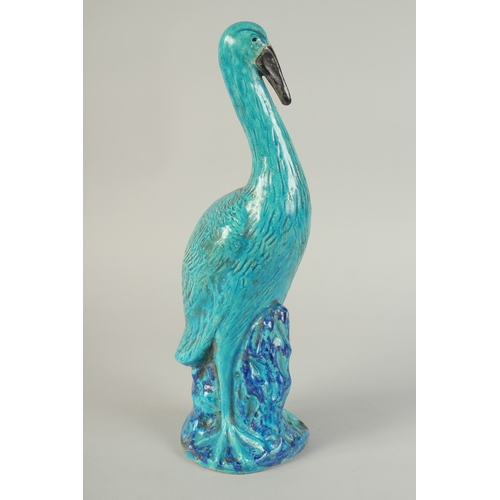 96 - A LARGE CHINESE TURQUOISE / BLUE GLAZED POTTERY CRANE, 39.5cm high.