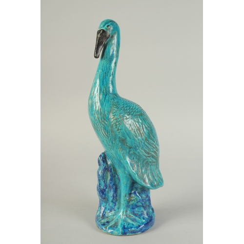 96 - A LARGE CHINESE TURQUOISE / BLUE GLAZED POTTERY CRANE, 39.5cm high.
