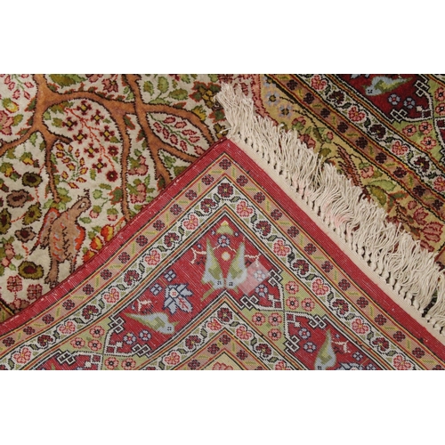 1003 - A SMALL PERSIAN PART SILK RUG cream ground with red ground border, 