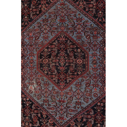 1007 - A GOOD PERSIAN RUG pale blue ground, central panel with all over stylised design. 6ft 5ins x 4ft 4in... 