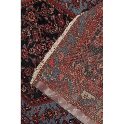 1007 - A GOOD PERSIAN RUG pale blue ground, central panel with all over stylised design. 6ft 5ins x 4ft 4in... 