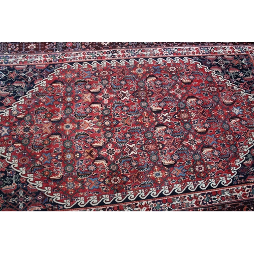 1008 - A GOOD PERSIAN CARPET red ground with all over stylised decoraction. 8ft 8ins x 5ft 4ins.