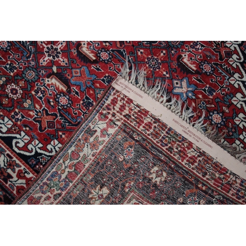 1008 - A GOOD PERSIAN CARPET red ground with all over stylised decoraction. 8ft 8ins x 5ft 4ins.