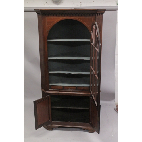 1015 - A GOOD GEORGE III MAHOGANY STANDING CORNER CUPBOARD the top with glass door enclosing two shaped she... 