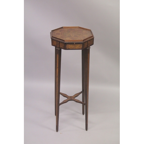 1020 - A GEORGIAN MAHOGANY INLAID OCTAGONAL TOP URN STAND with brushing slide on tapering legs with cross s... 