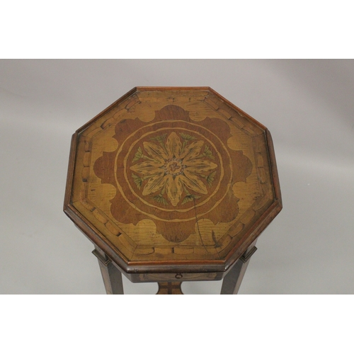 1020 - A GEORGIAN MAHOGANY INLAID OCTAGONAL TOP URN STAND with brushing slide on tapering legs with cross s... 