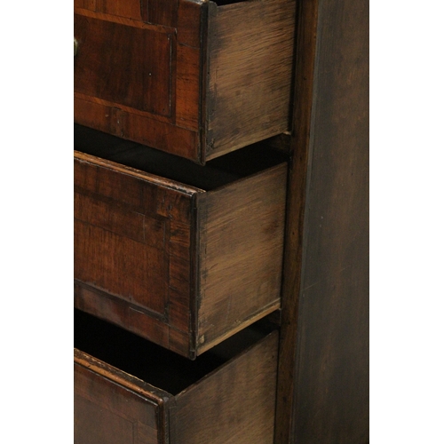 1024 - AN 18TH CENTURY OAK AND WALNUT CHEST ON STAND the top with two short and three long graduated drawer... 