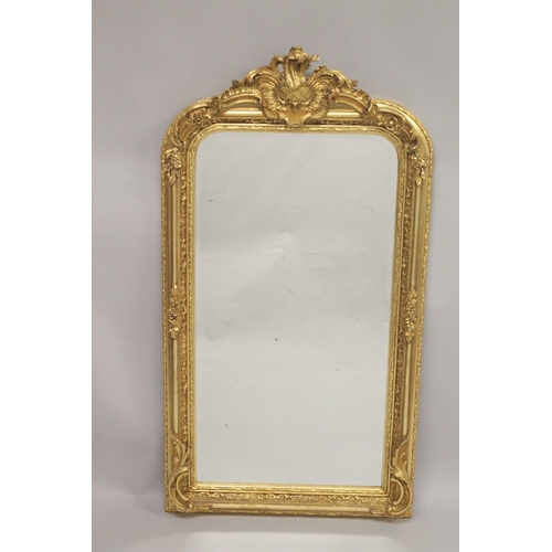 1031 - A GOOD LARGE GILTWOOD UPRIGHT MIRROR with acanthus and scrolls. 5ft 2ins high, 2ft 7ins wide.