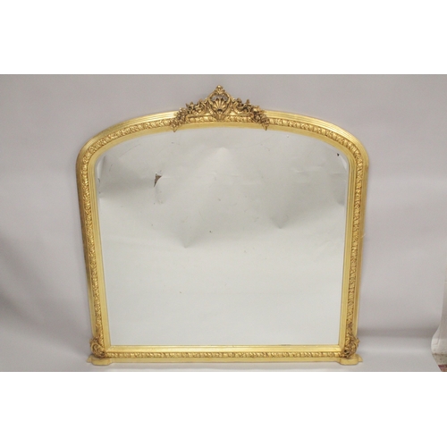 1032 - A GOOD LARGE GILTWOOD OVERMANTLE MIRROR with shell finials with garlands. 5ft 3ins high, 6ft wide.... 