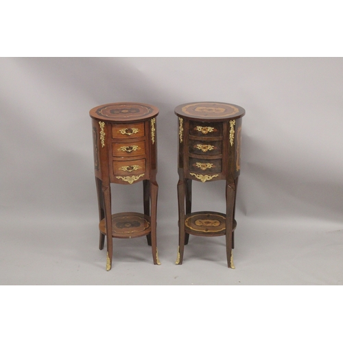 1037 - A GOOD PAIR OF LOUIS XVITH DESIGN CIRCULAR BEDSIDE TABLES fitted with four drawers with curving legs... 