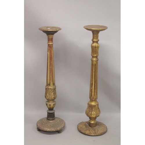 1044 - A GOOD PAIR OF GILTWOOD STANDS with circular top. 9ins  diameter, fluted columns and circular bases.... 