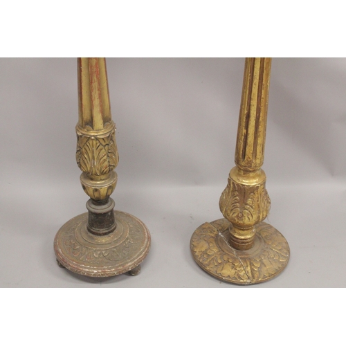 1044 - A GOOD PAIR OF GILTWOOD STANDS with circular top. 9ins  diameter, fluted columns and circular bases.... 