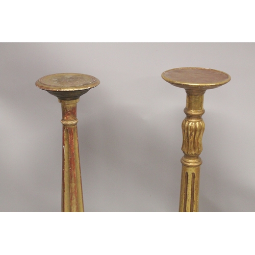 1044 - A GOOD PAIR OF GILTWOOD STANDS with circular top. 9ins  diameter, fluted columns and circular bases.... 