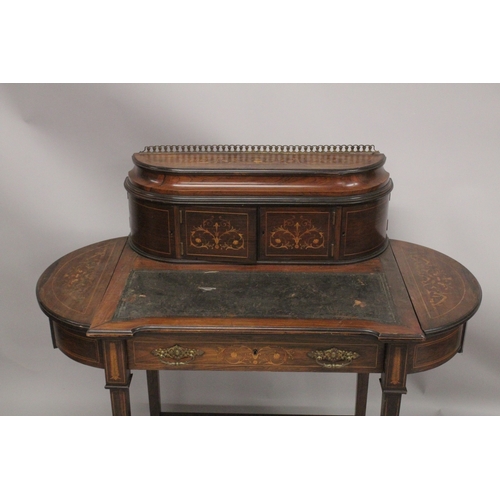 1047 - A LADIES VICTORIAN ROSEWOOD INLAID WRITING DESK with brass galley, a pair of panel doors, leather wr... 