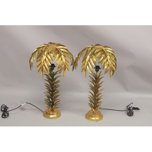 1051 - A PAIR OF GILT METAL PALM TREE TABLE LAMPS. 2ft high.