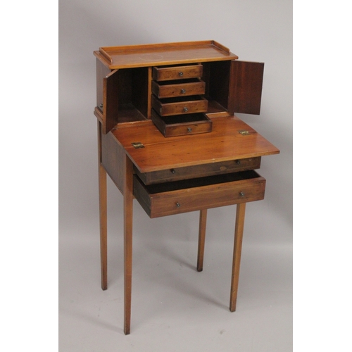 1053 - A SMALL YEW WOOD DESK the top with three drawers and a pair of panel doors, fold over flap over two ... 