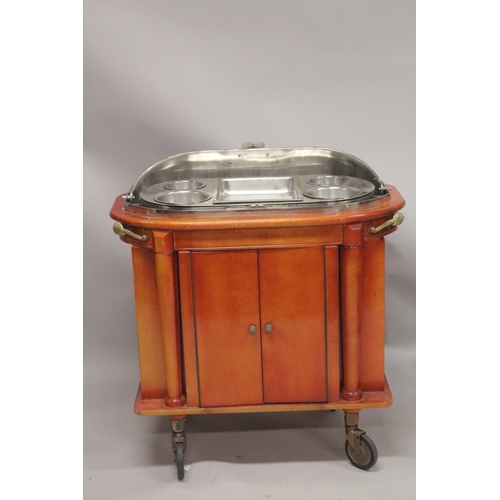 1054 - A GOOD HOTEL METAL TROLLEY with rising folding copper cover,  fitted interior over a pair of panel d... 