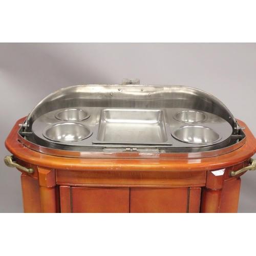 1054 - A GOOD HOTEL METAL TROLLEY with rising folding copper cover,  fitted interior over a pair of panel d... 