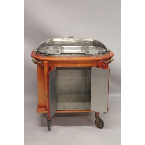 1054 - A GOOD HOTEL METAL TROLLEY with rising folding copper cover,  fitted interior over a pair of panel d... 