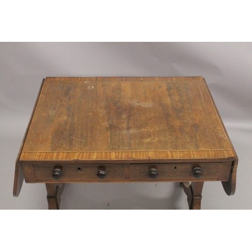 1055 - A REGENCY ROSEWOOD SOFA TABLE with folding flaps, on curving legs with casters. 4ft 4ins long flaps ... 