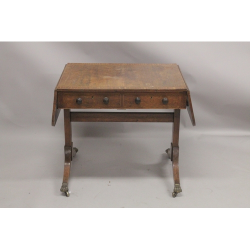 1055 - A REGENCY ROSEWOOD SOFA TABLE with folding flaps, on curving legs with casters. 4ft 4ins long flaps ... 