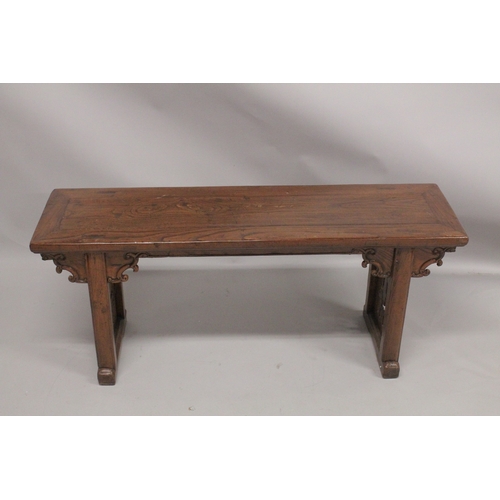 1057 - A LONG LOW CHINESE TABLE. 4ft 2ins long, 1ft 9ins high.